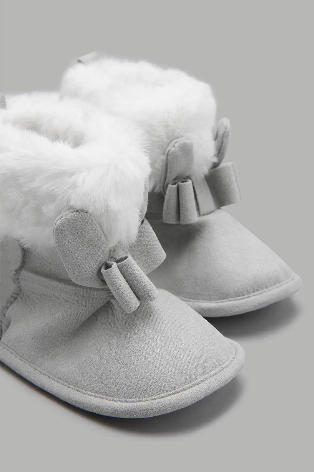Grey Boot With a Bow